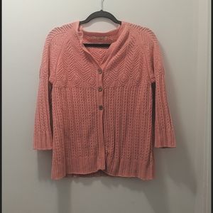 Pink three button cardigan.
